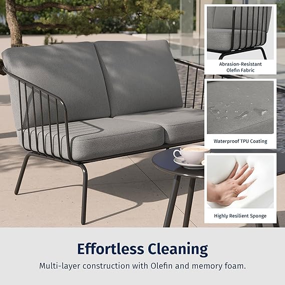Oval 4-piece patio set by Patios – black metal frame with light grey cushions (طقم جلسات حدائق من Patios – إطار أسود ووسائد رمادية فاتحة)
