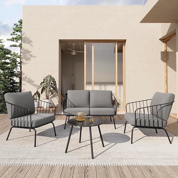 Oval 4-piece patio set by Patios – black metal frame with light grey cushions (طقم جلسات حدائق من Patios – إطار أسود ووسائد رمادية فاتحة)
