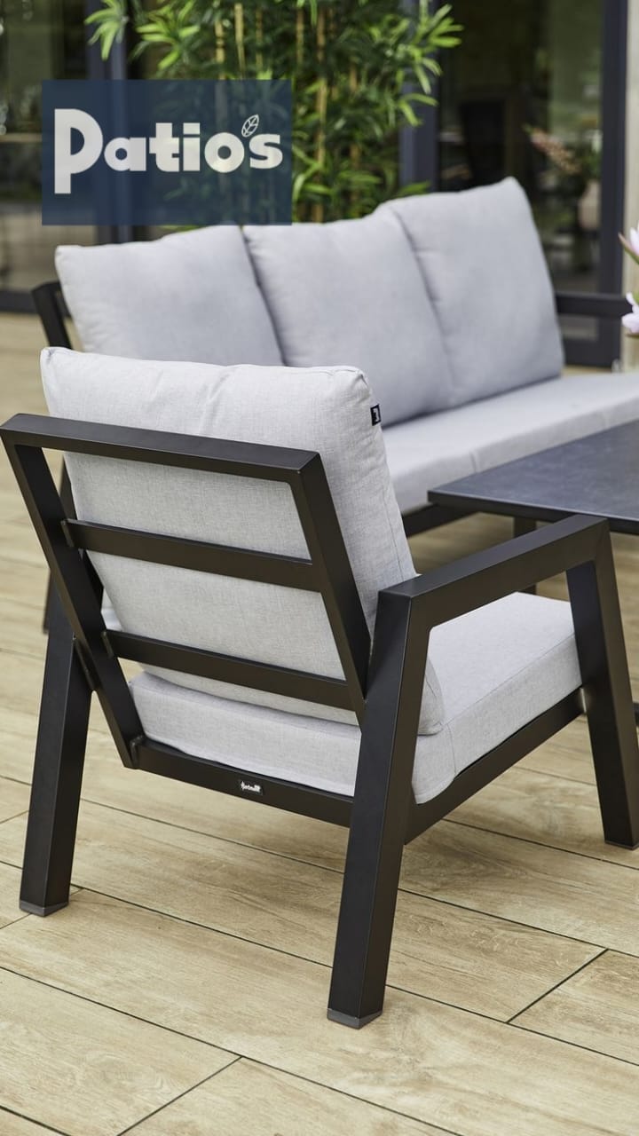 outdoor furniture set by Patios – black metal frame with wood accent and grey cushions (طقم حديقة من Patios بإطار معدني وخشب ووسائد رمادية)
