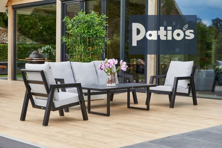 outdoor furniture set by Patios – black metal frame with wood accent and grey cushions (طقم حديقة من Patios بإطار معدني وخشب ووسائد رمادية)
