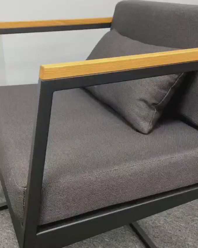 outdoor furniture set by Patios – black metal frame with wood accent and grey cushions (طقم حديقة من Patios بإطار معدني وخشب ووسائد رمادية)
